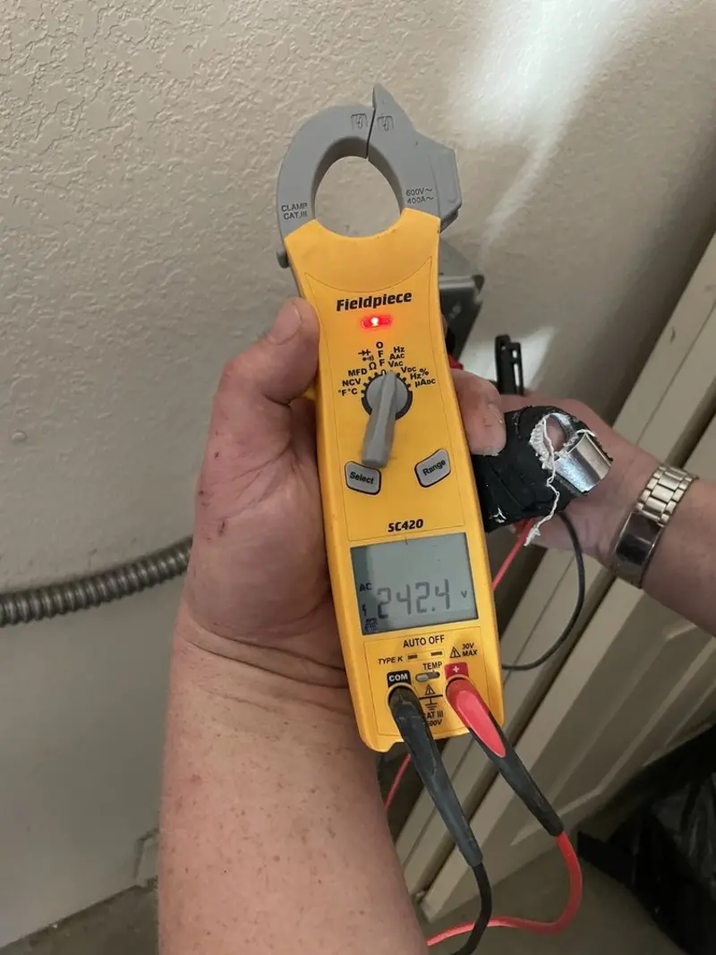 Voltage testing with clamp meter during Electrical Installation Services in Etowah
